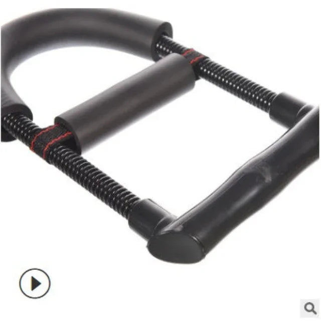 Close-up of a black spring chest expander, arm exercise equipment with foam handles