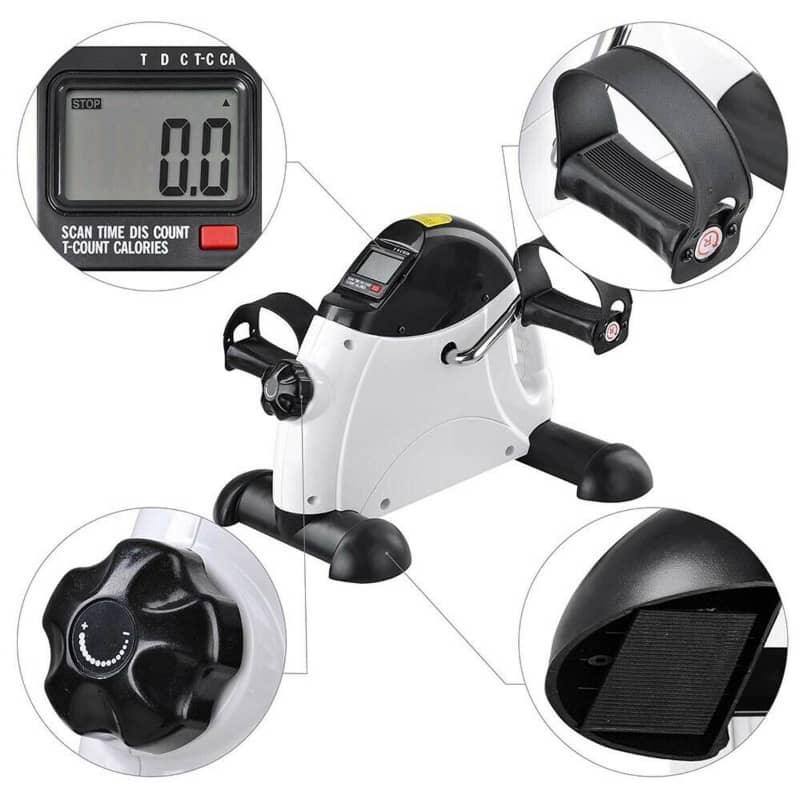Mini exercise bike with digital display and various components on a white background
