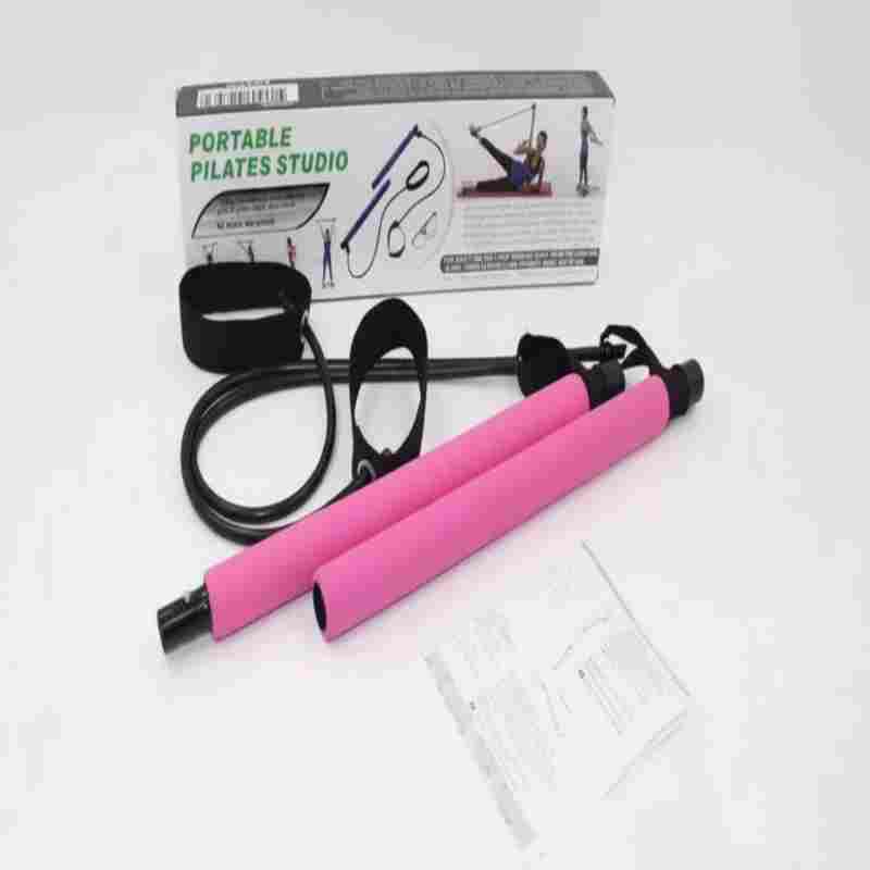Portable Pilates Studio set with pink exercise bar, resistance bands, and ankle straps on white background.