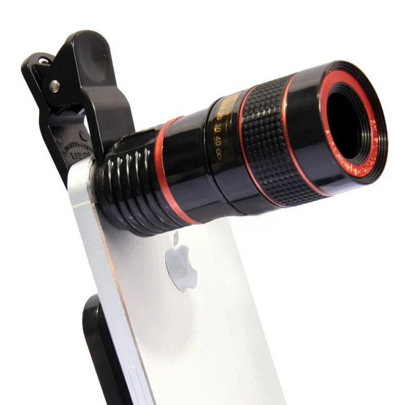 Clip-on smartphone zoom lens attached to a silver phone, close-up view