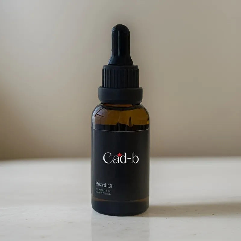 Bottle of Cad-b beard oil on a neutral background