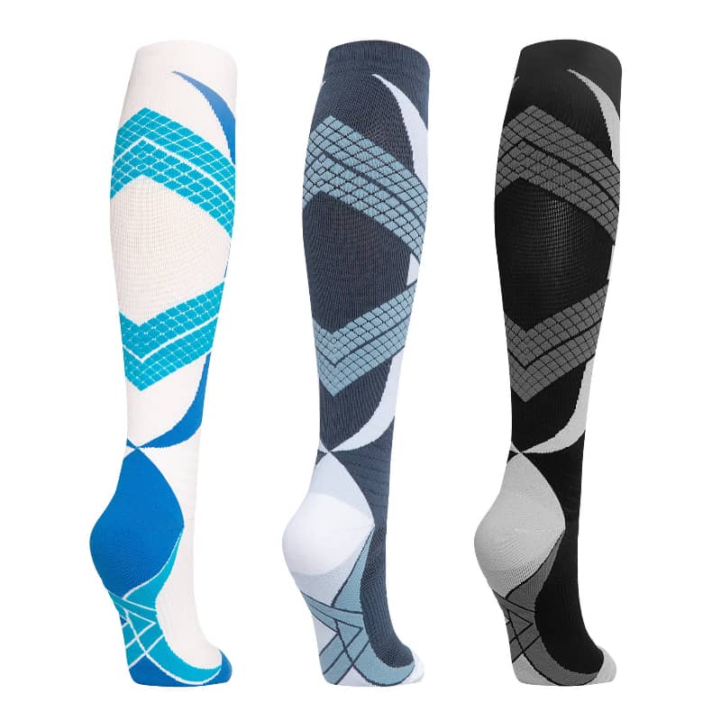Three pairs of knee-high socks with geometric patterns on a white background