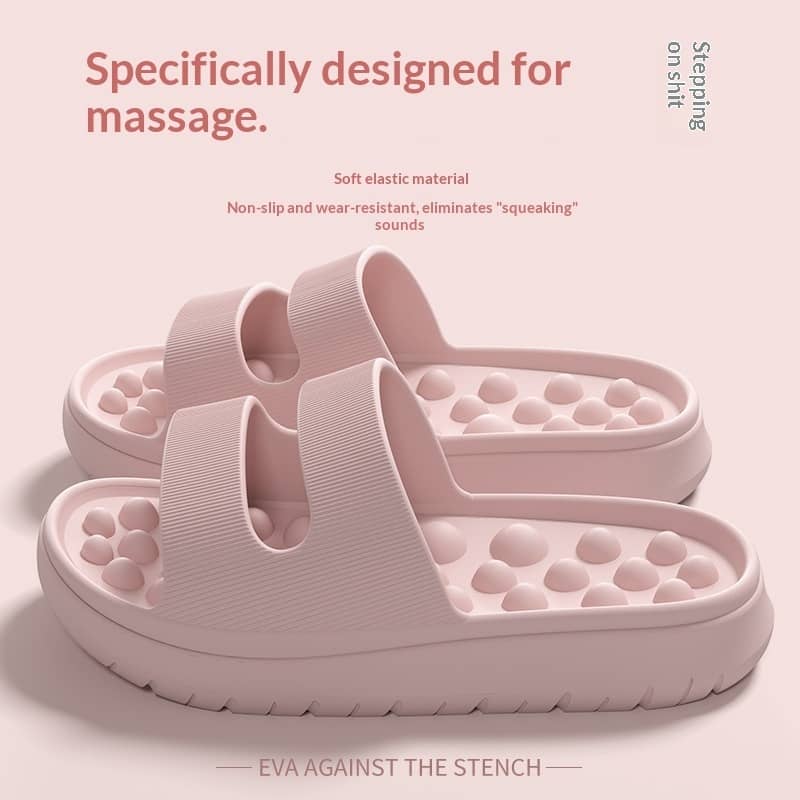 Pink massage slippers with text on a light pink background