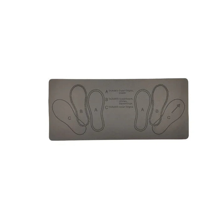 Gray fitness mat with printed foot placement guides for exercise and workout alignment