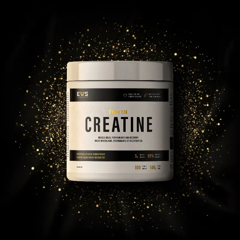 A white tub of EWS Creatine 240g supplement powder, centered against a black background with a gold glittery particle effect.