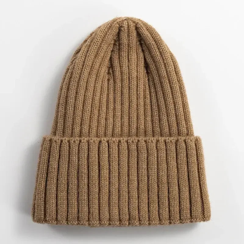 Brown ribbed knit beanie hat, warm winter outdoor fitness accessory on white background