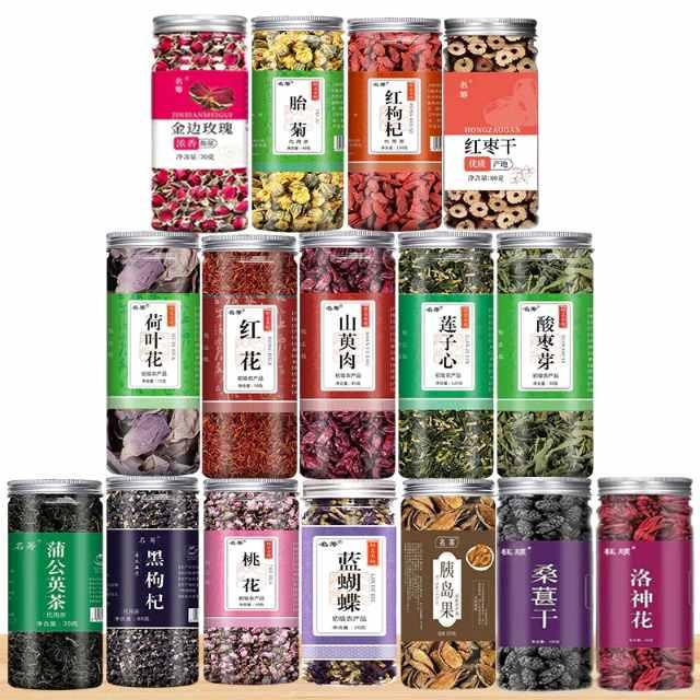 Assorted herbal teas and dried botanicals in labeled jars, including rose, chrysanthemum, goji, and hibiscus for wellness
