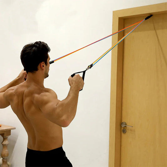 Man using resistance bands anchored to door for home strength training workout