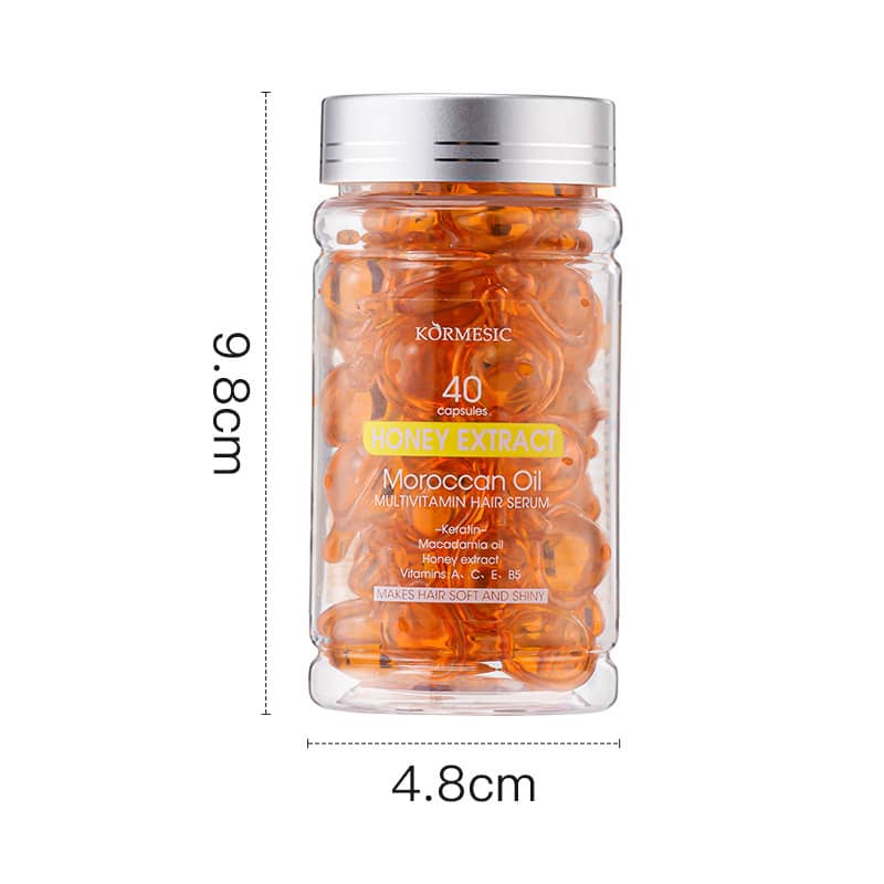 Glass jar with honey extract capsules labeled 'Kormesic' on a white background