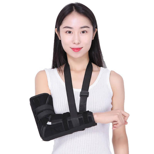 Woman wearing a black arm sling on a white background