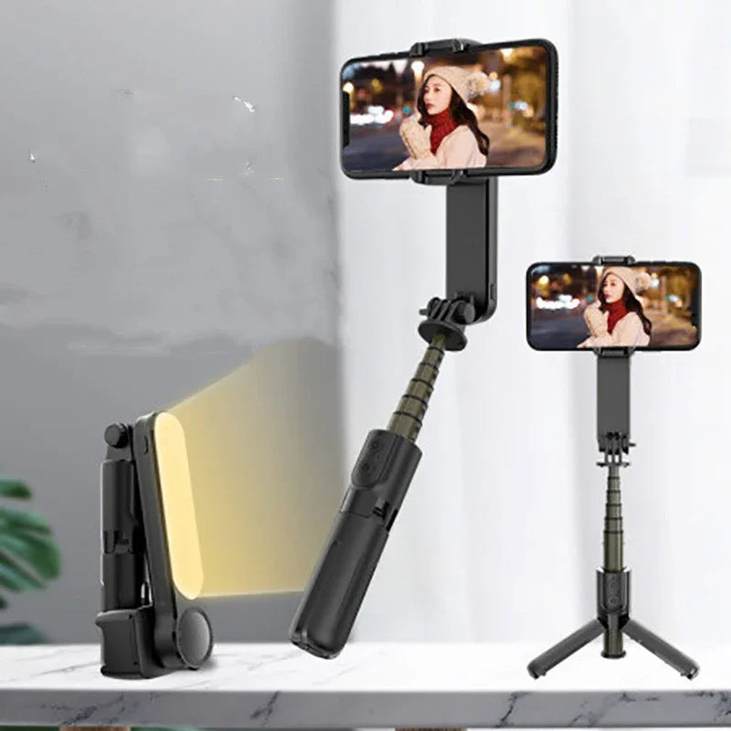 Adjustable selfie stick tripod with LED light and smartphone holder for vlogging or video calls