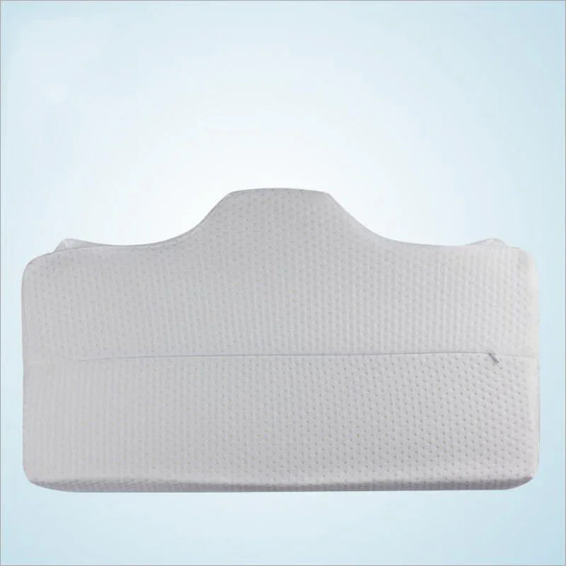 Ergonomic white memory foam pillow for neck and back support on light blue background