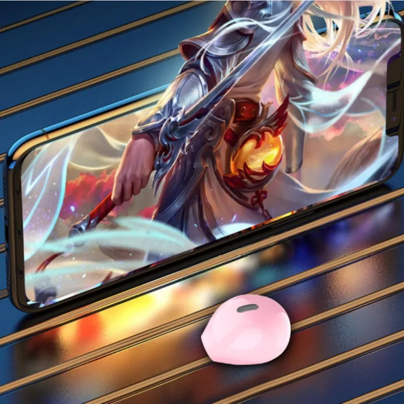 Smartphone displaying a fantasy character on screen with a small pink device in front