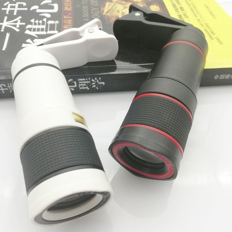 Two monoculars with black and red design on a white surface.