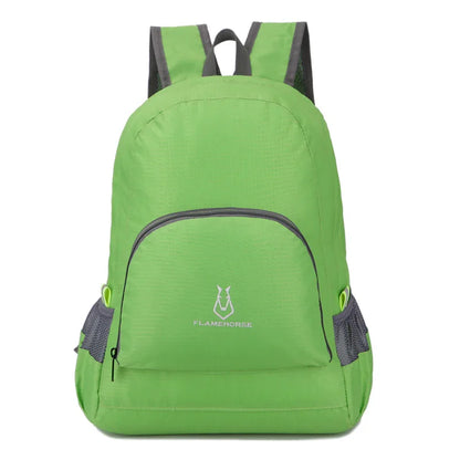 Lightweight green backpack with front zip pocket and side mesh pockets, outdoor gear.
