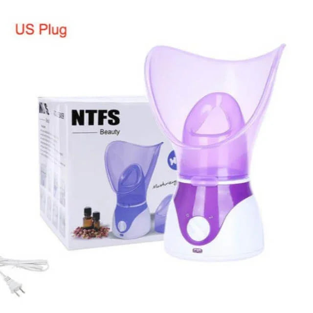 Purple and white facial steamer with US plug, shown with box and essential oils