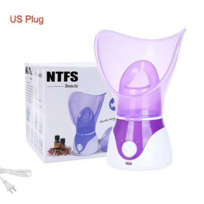 Purple and white facial steamer with US plug, shown with box and essential oils