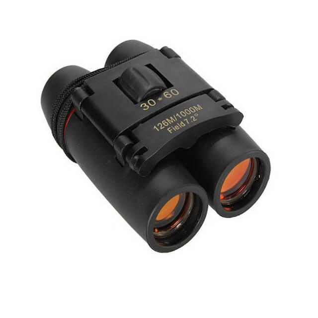 Black binoculars with orange lenses on a white background