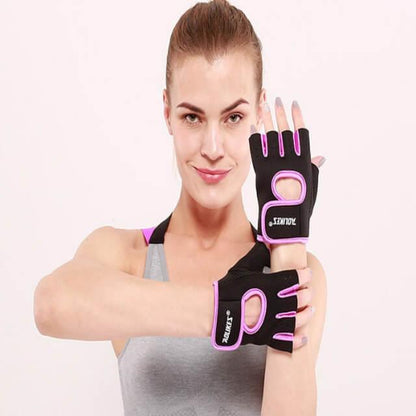 Woman wearing black and pink gloves with visible branding on a plain background