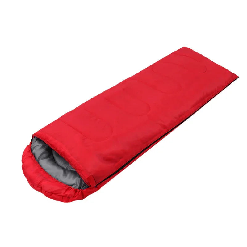 Red rectangular sleeping bag with grey inner lining for camping and outdoor use