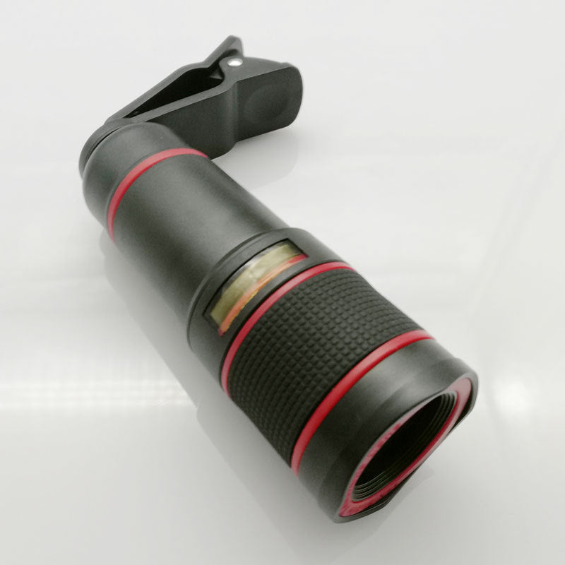 Phone camera lens with black and red design on a white background