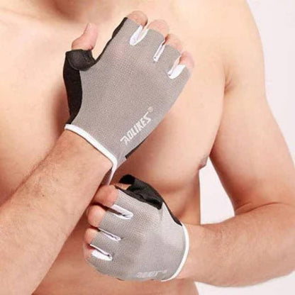 Man wearing gray fingerless workout gloves for gym or fitness training