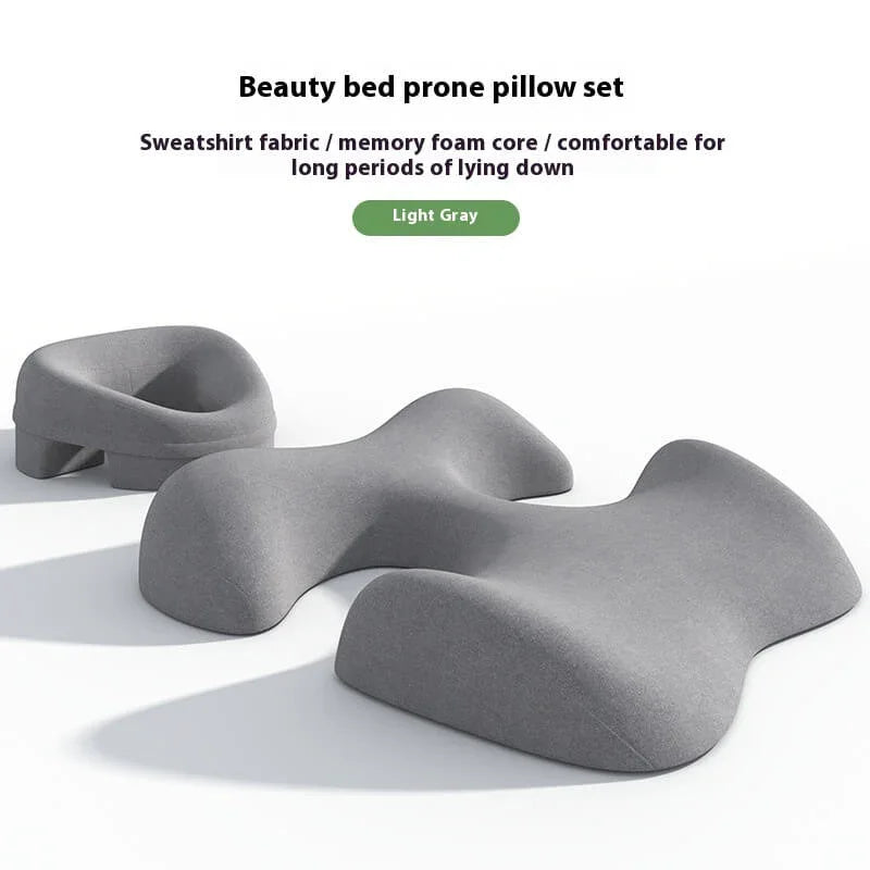 Light gray memory foam beauty bed prone pillow set with ergonomic design on white background