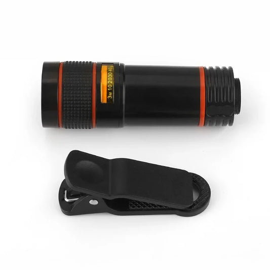 Compact black tactical flashlight with orange trim and included belt clip, ideal for outdoor gear