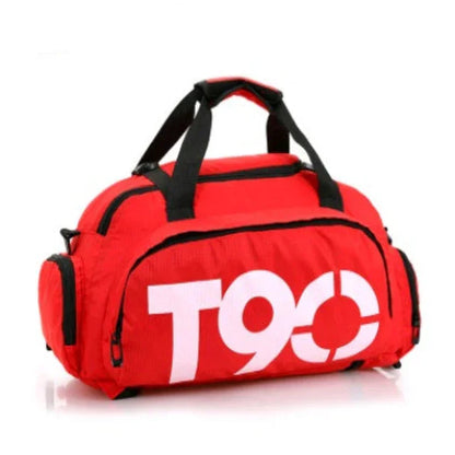 Red gym duffel bag with T90 logo, black handles, and multiple zippered pockets