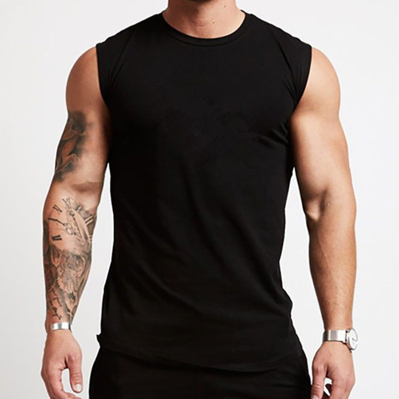 Person wearing a black sleeveless shirt on a plain background