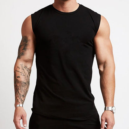 Person wearing a black sleeveless shirt on a plain background