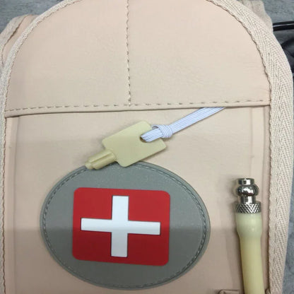 Beige bag with a red cross emblem on a gray background