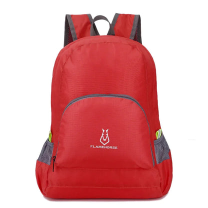 Red outdoor backpack with front pocket and mesh side pockets, ideal for fitness and hiking