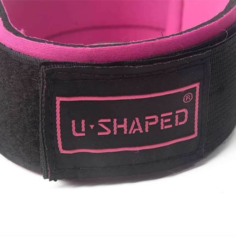 Black waist trainer with pink interior and 'U-Shaped' logo on a white background