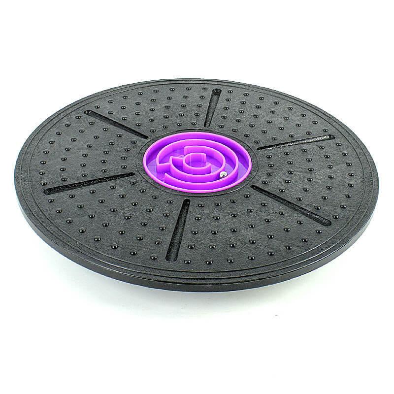 Black exercise disc with purple center on a white background