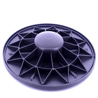 Gray circular object with a central knob on a white background