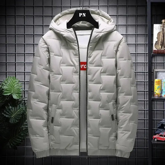 Light grey puffer jacket with hood, front zipper, and modern quilted design on display rack