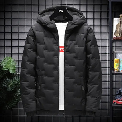 Black puffer jacket with hood and side pockets displayed on a hanger against grid wall
