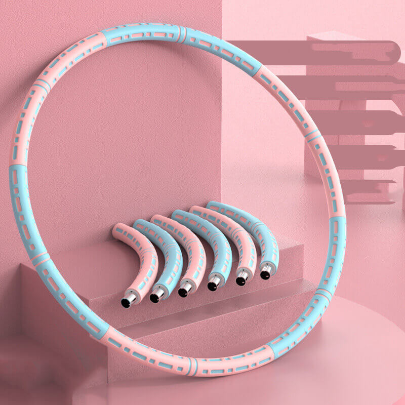 Pink and blue hula hoop with additional hoops on a pink geometric background