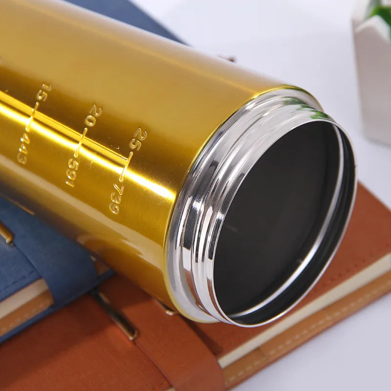 Close-up of a metallic gold telescope eyepiece with engraved measurement markings, resting on a brown leather journal cover.