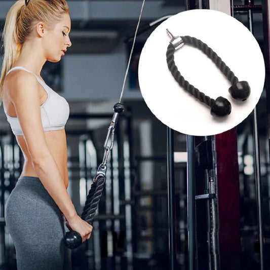 Woman using gym tricep rope attachment for cable machine strength training workout