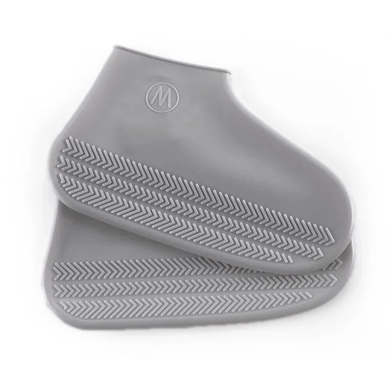 Gray silicone shoe covers with textured non-slip grip, fitness gear from Hi Fitness