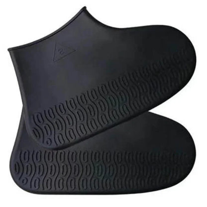 Black rubber booties with textured sole on a white background