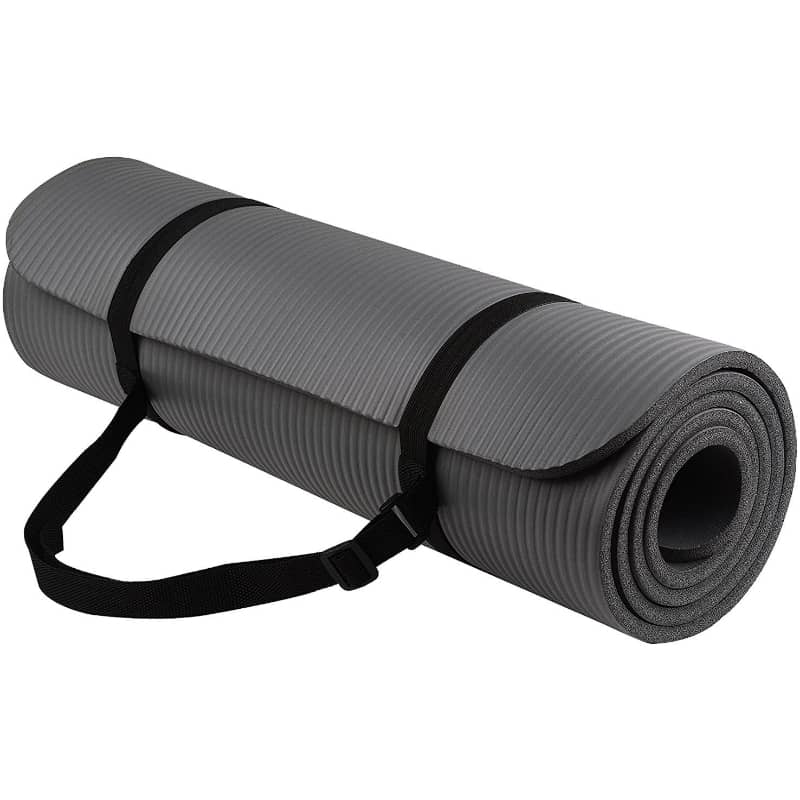 Rolled gray yoga mat with carrying strap, fitness equipment for home or gym workouts