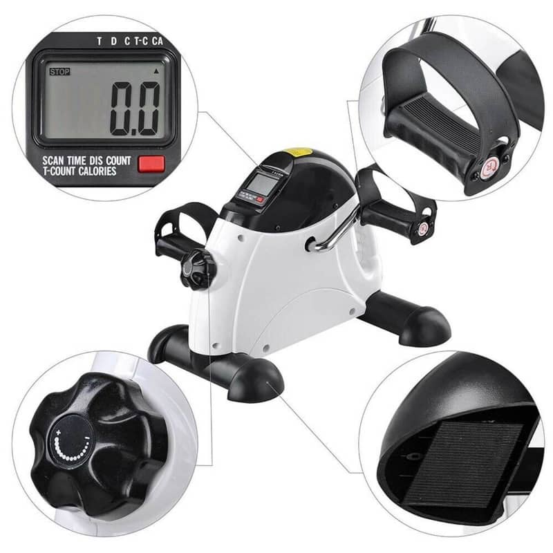 Mini exercise bike with digital display and various components on a white background