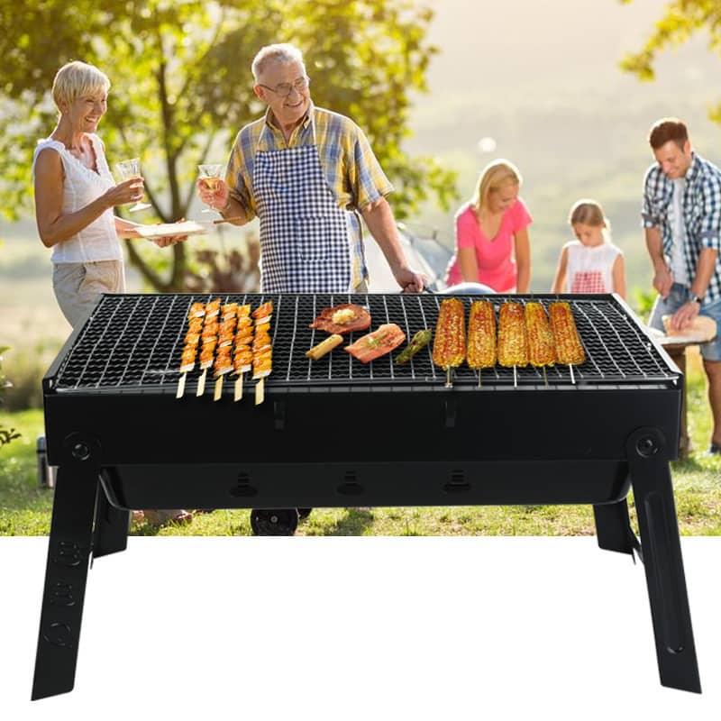 Portable outdoor grill with skewers, corn, and food, family enjoying barbecue in backyard.