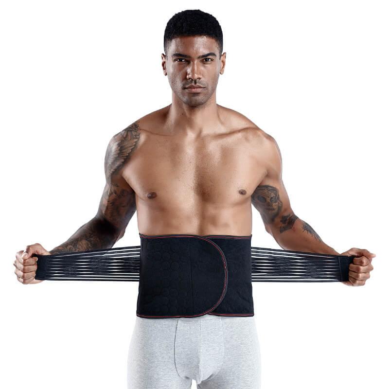 Man wearing a black waist trainer against a white background