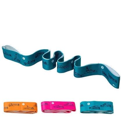 Set of colorful stretch resistance bands with printed exercise illustrations for fitness workouts