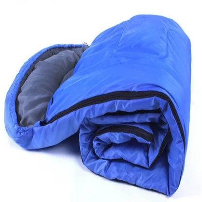 Rolled blue sleeping bag with black zipper, outdoor camping gear on white background