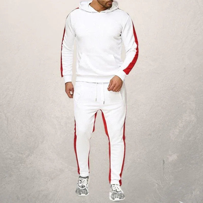 Man wearing white fitness hoodie and joggers with red stripes, styled for athletic workouts